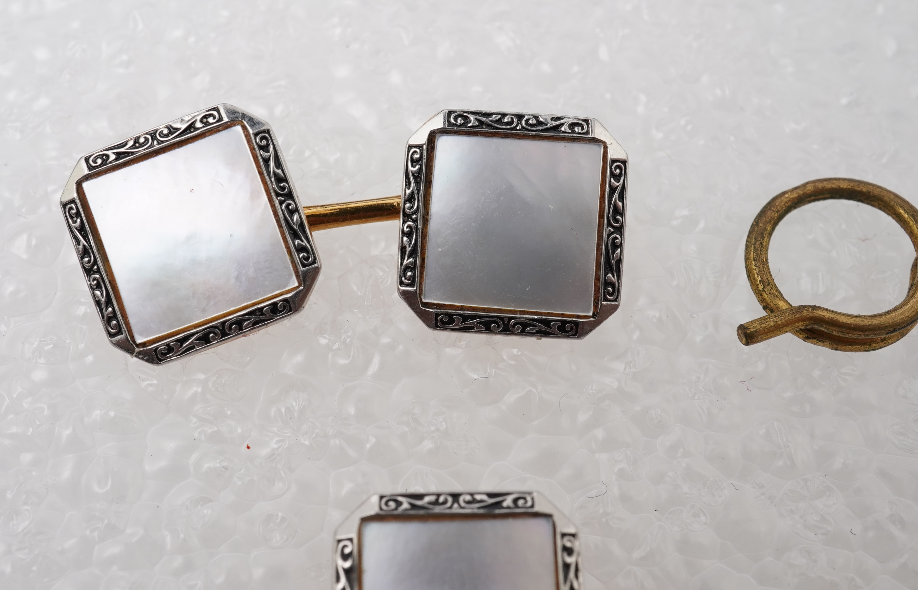 A mother of pearl dress set , early 20th century